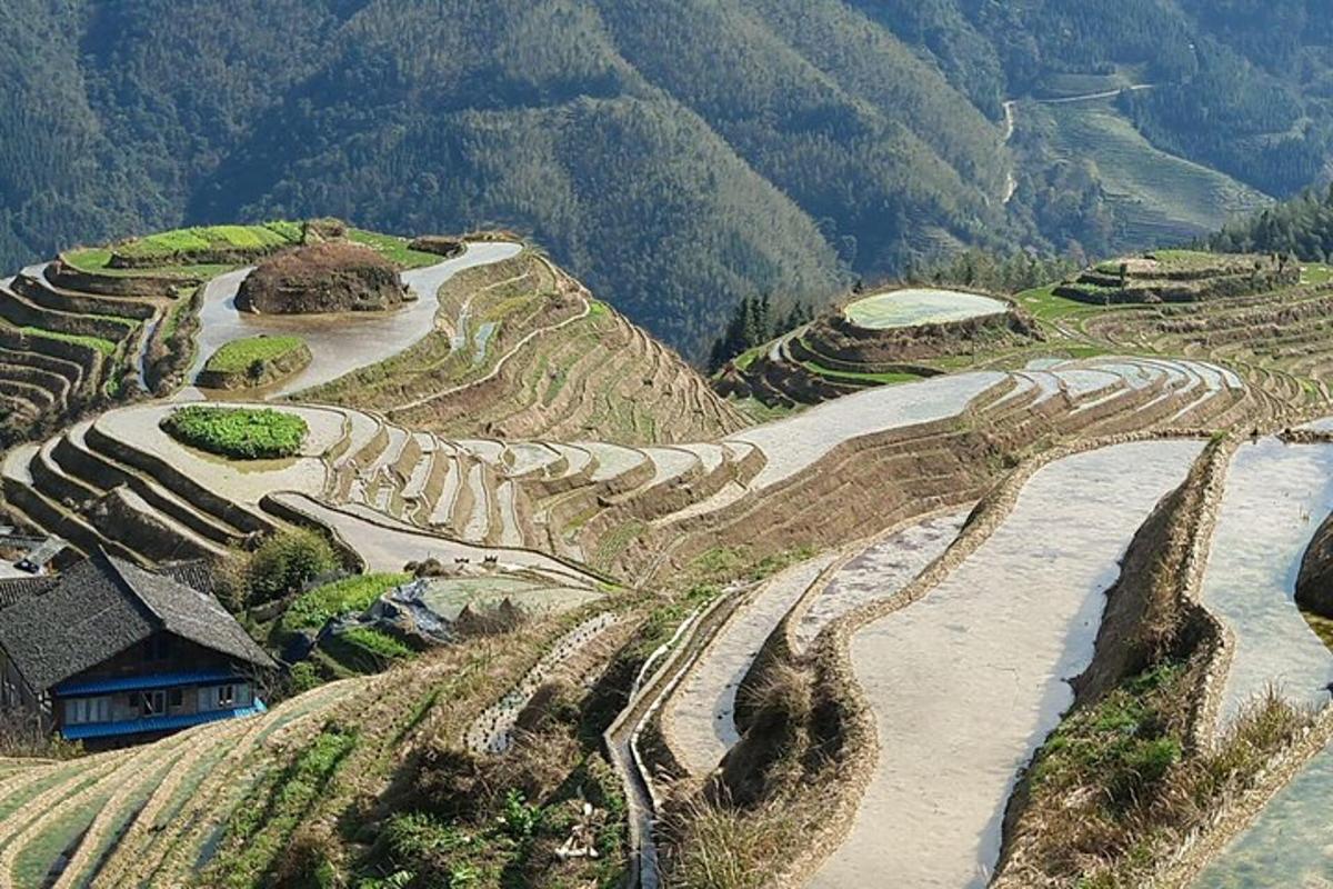 an aerial view of a mountain with a river