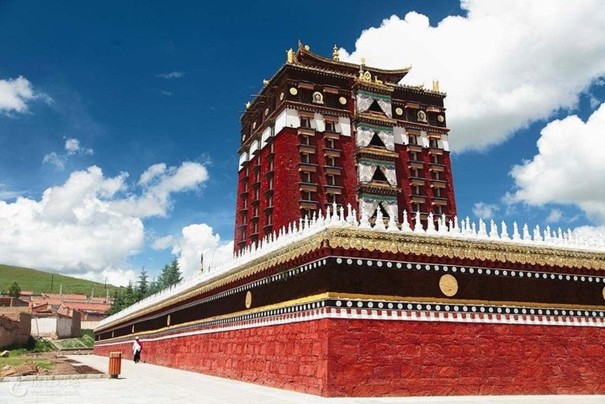 a large red building with a clock tower