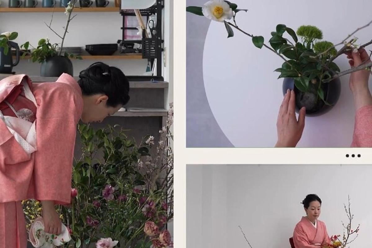 en kvinne i en rosa kjole som arrangerer en plante