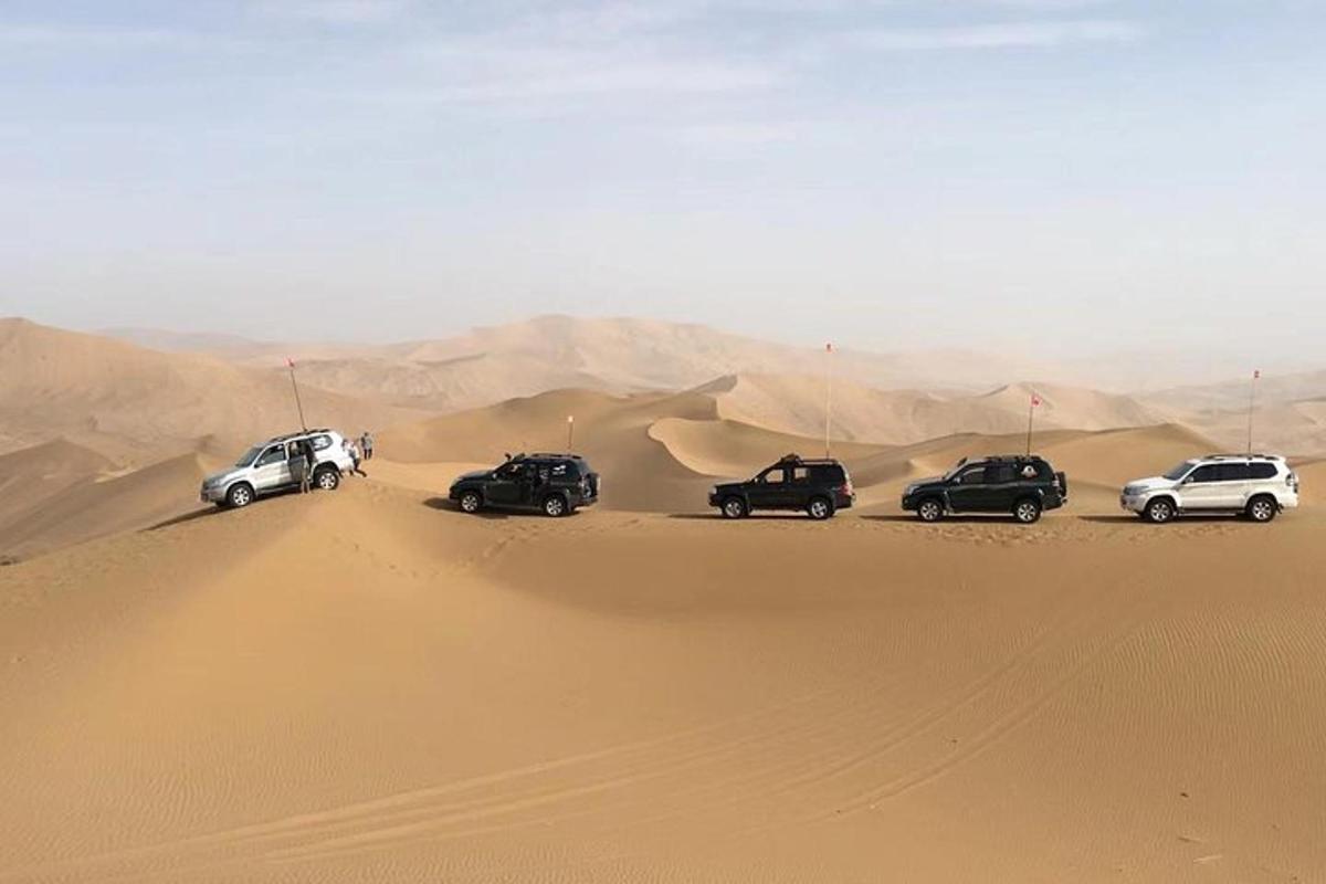 a group of cars parked in the desert