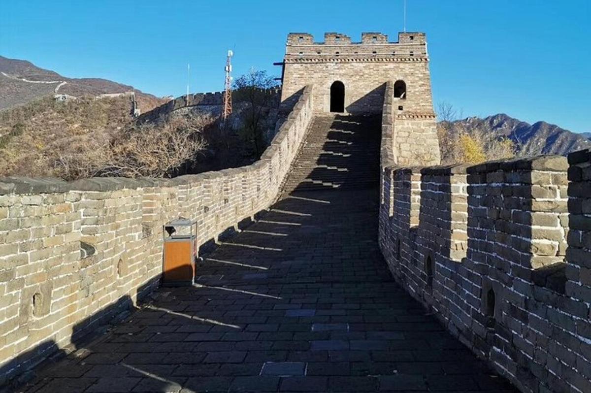 a large brick wall with a stairway on the great wall