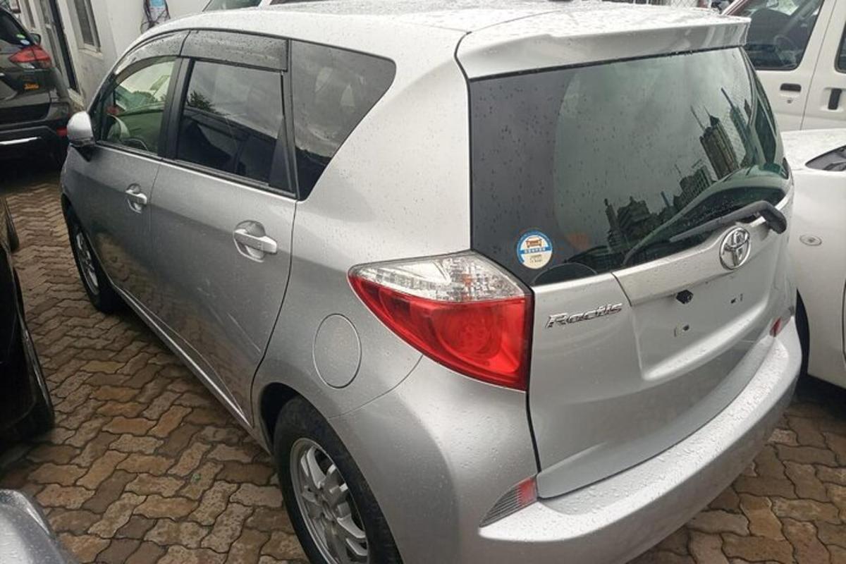 a silver car parked in a parking lot