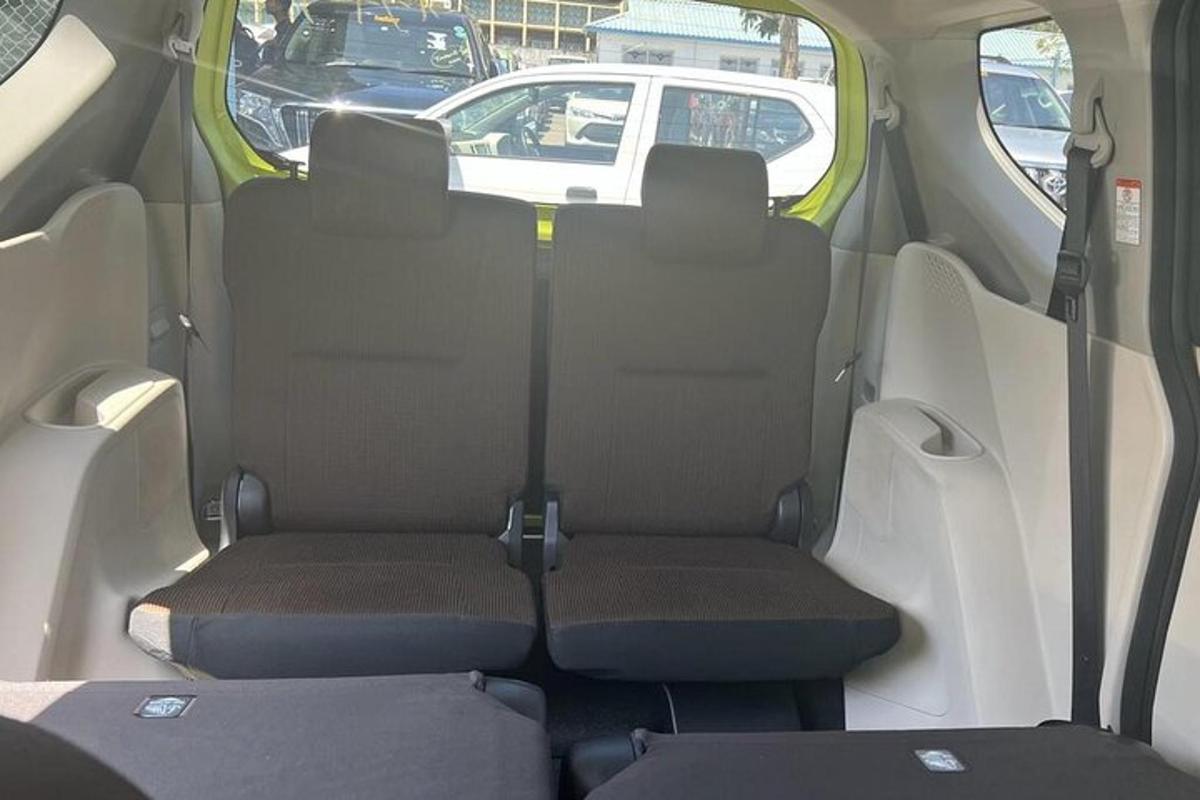 an open back seat of a minivan with the back seatsktopangering