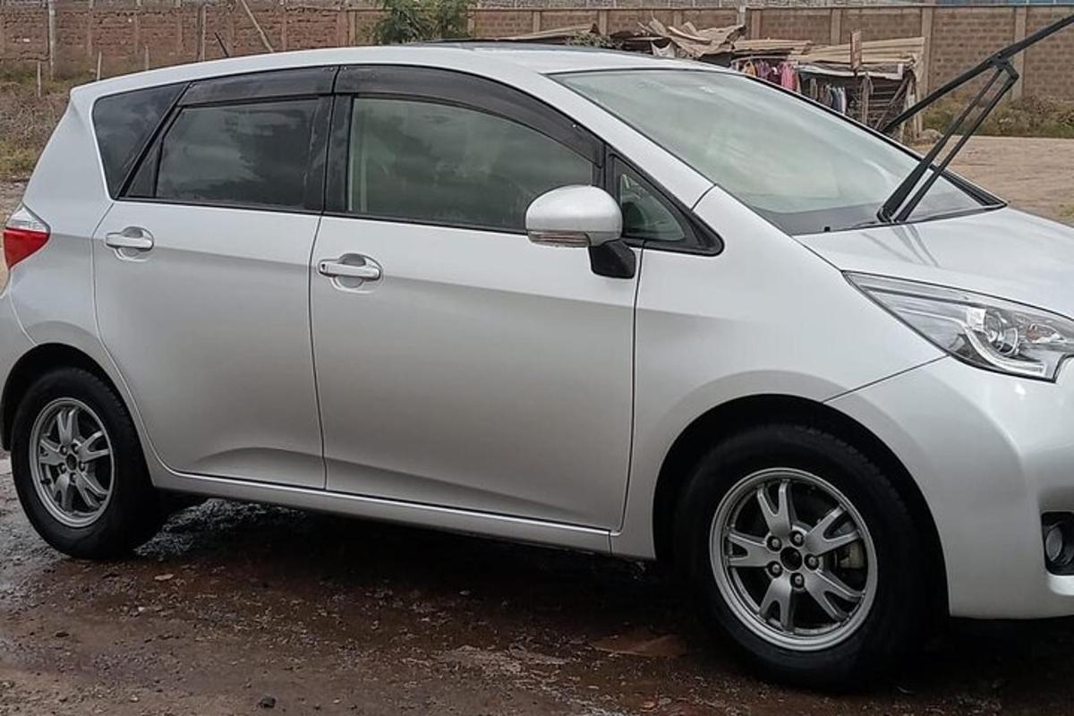 a silver car parked in a parking lot