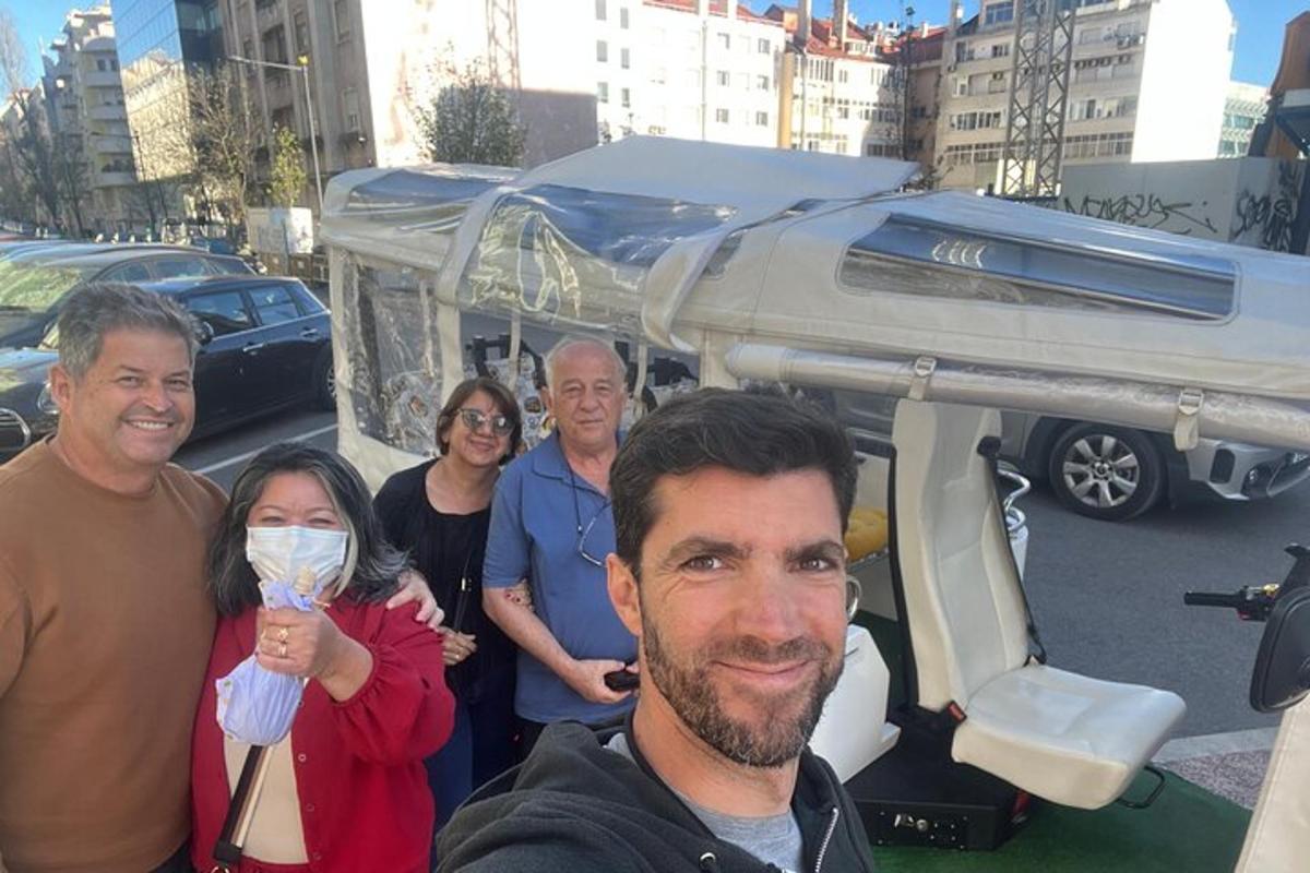 a group of people standing in front of a vehicle
