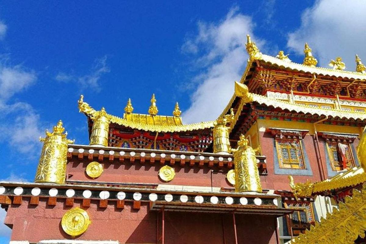 a building with gold decorations on top of it