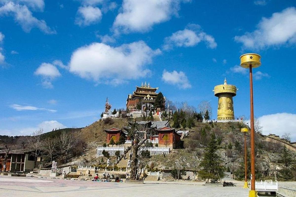 a building on top of a hill with a tower