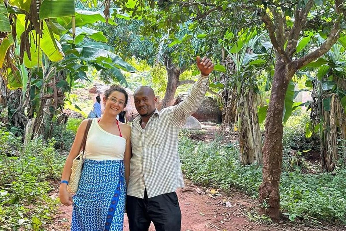 a man and a woman standing in a forest