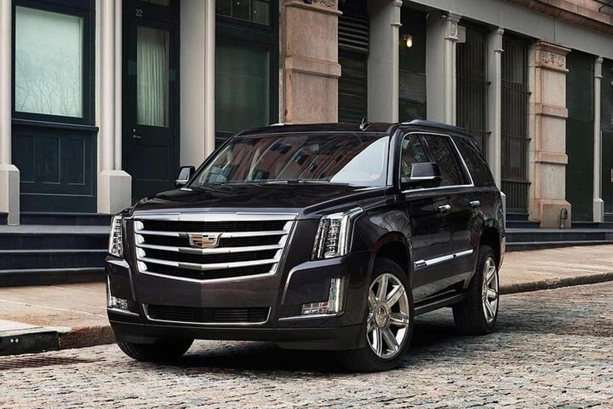 a black suv parked in front of a building
