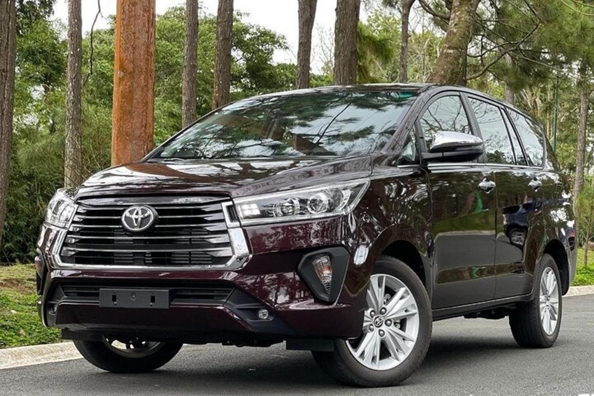 a black toyota fortuner parked on a road