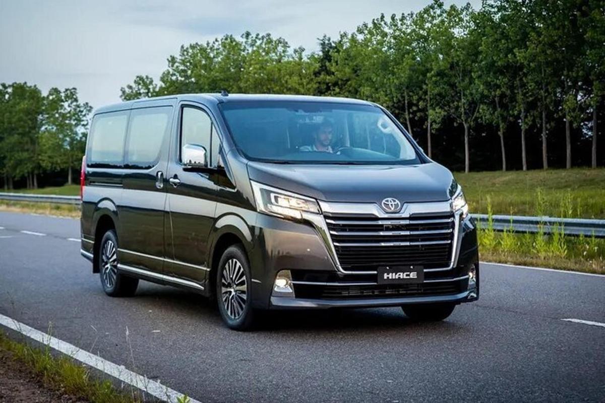 a van is driving down a road