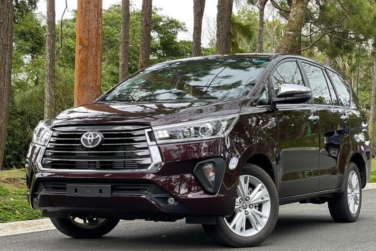 a black toyota fortuner parked on a road