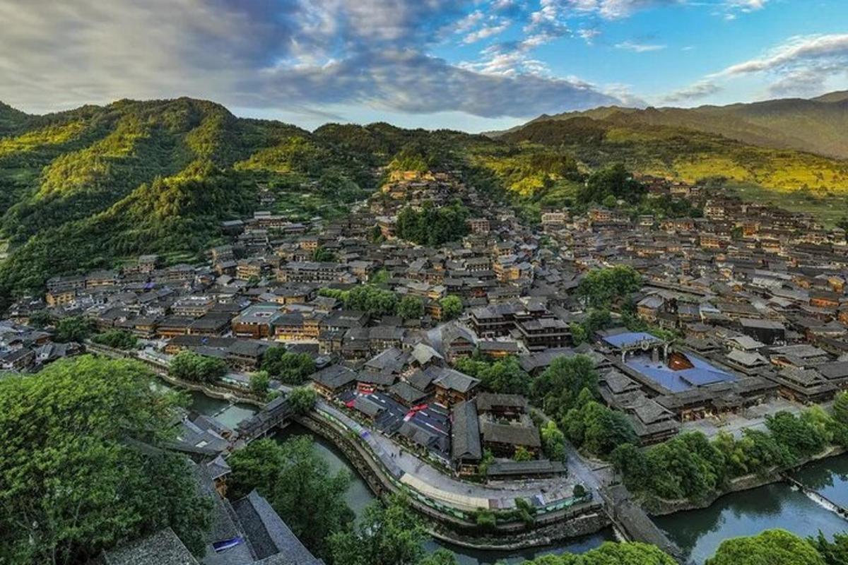 an aerial view of a town on a mountain