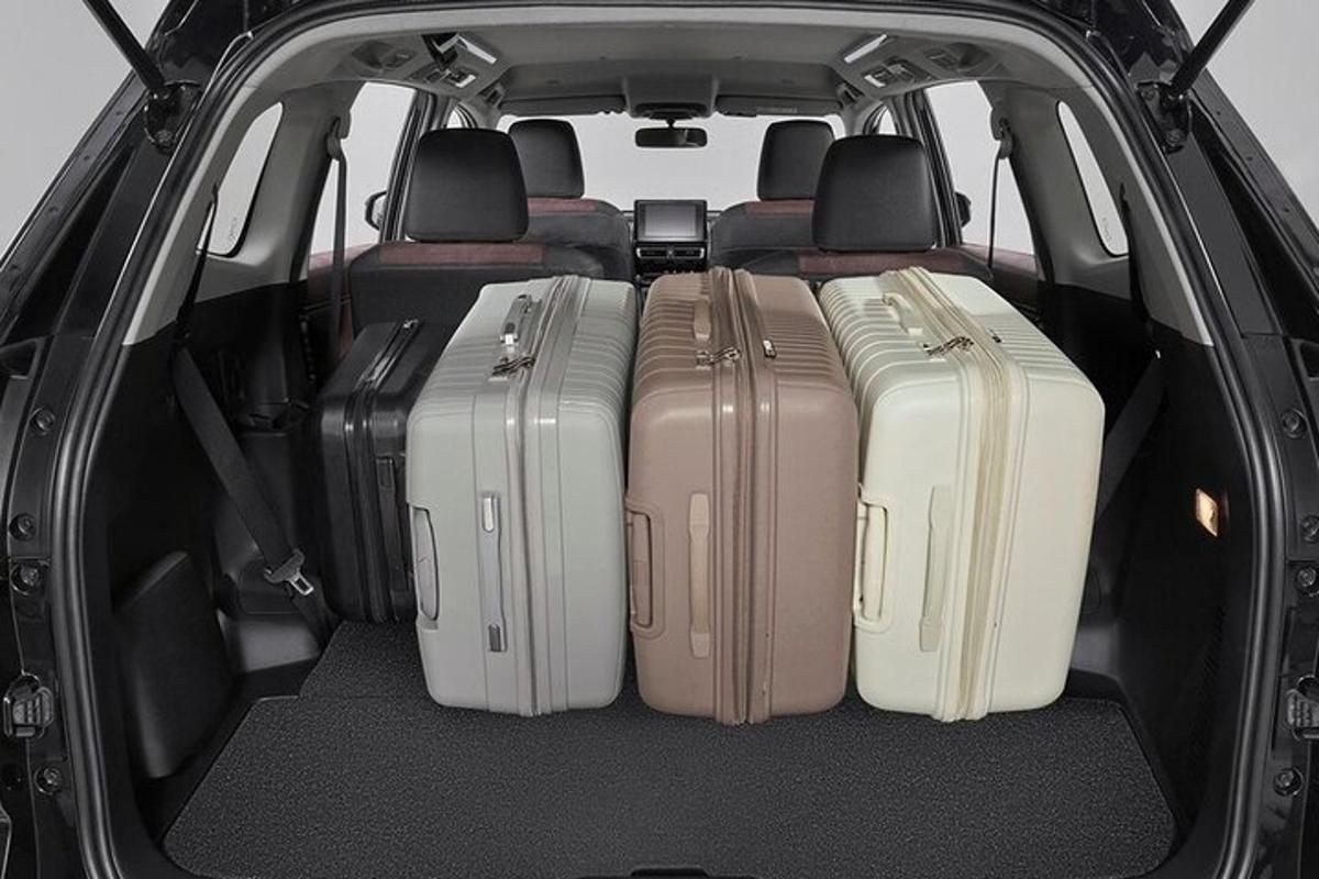 a group of suitcases in the back of a car