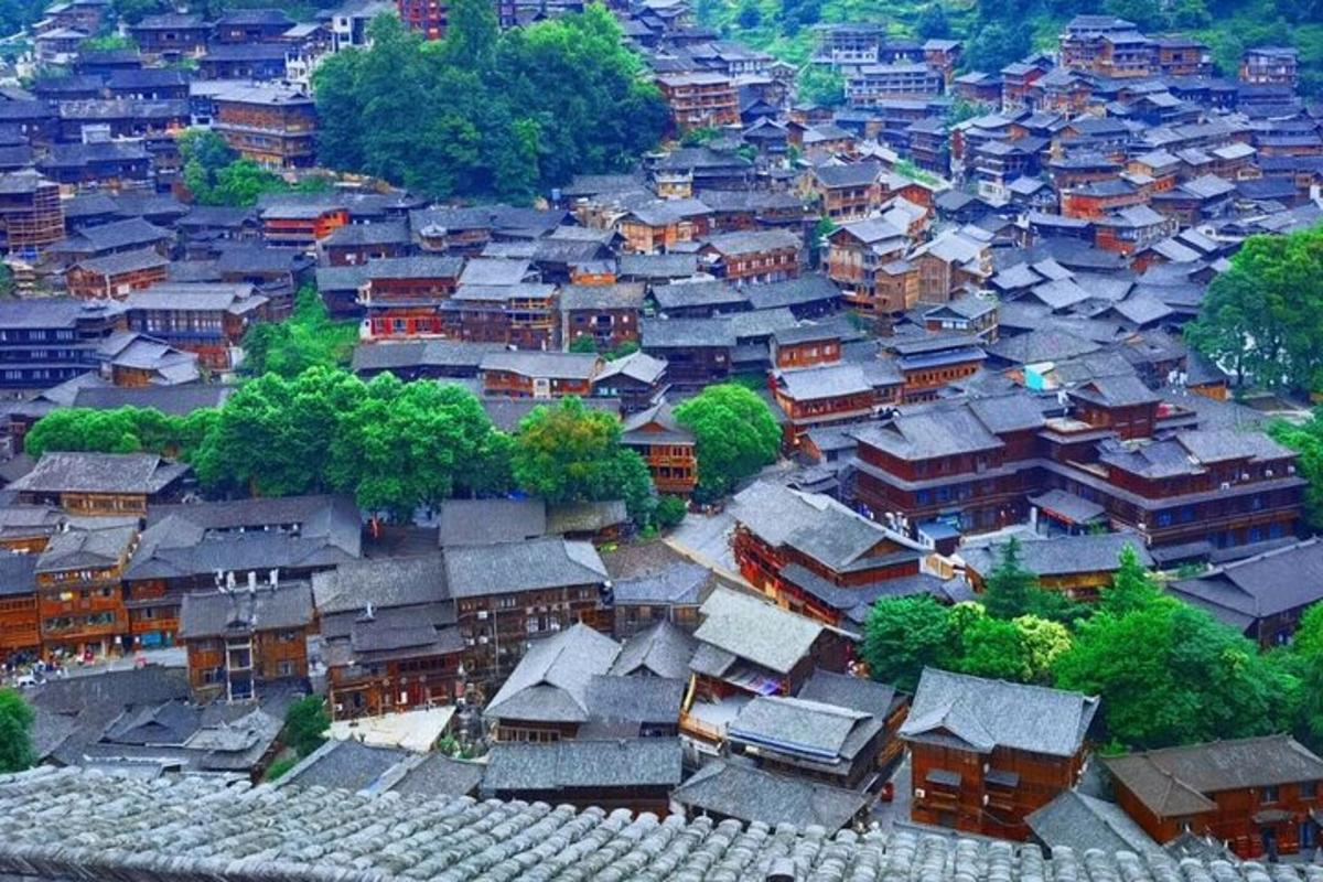 an overhead view of a village with houses and trees