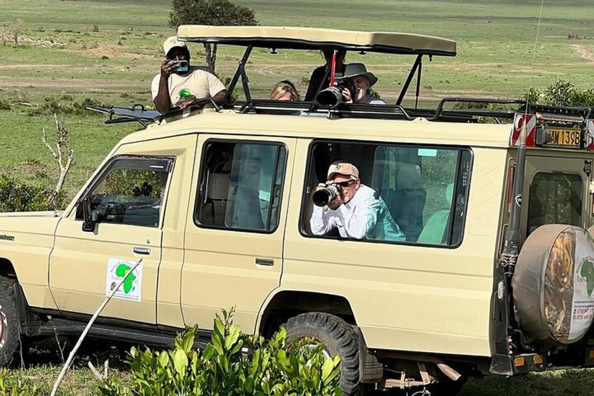 a group of people sitting in the back of a jeep