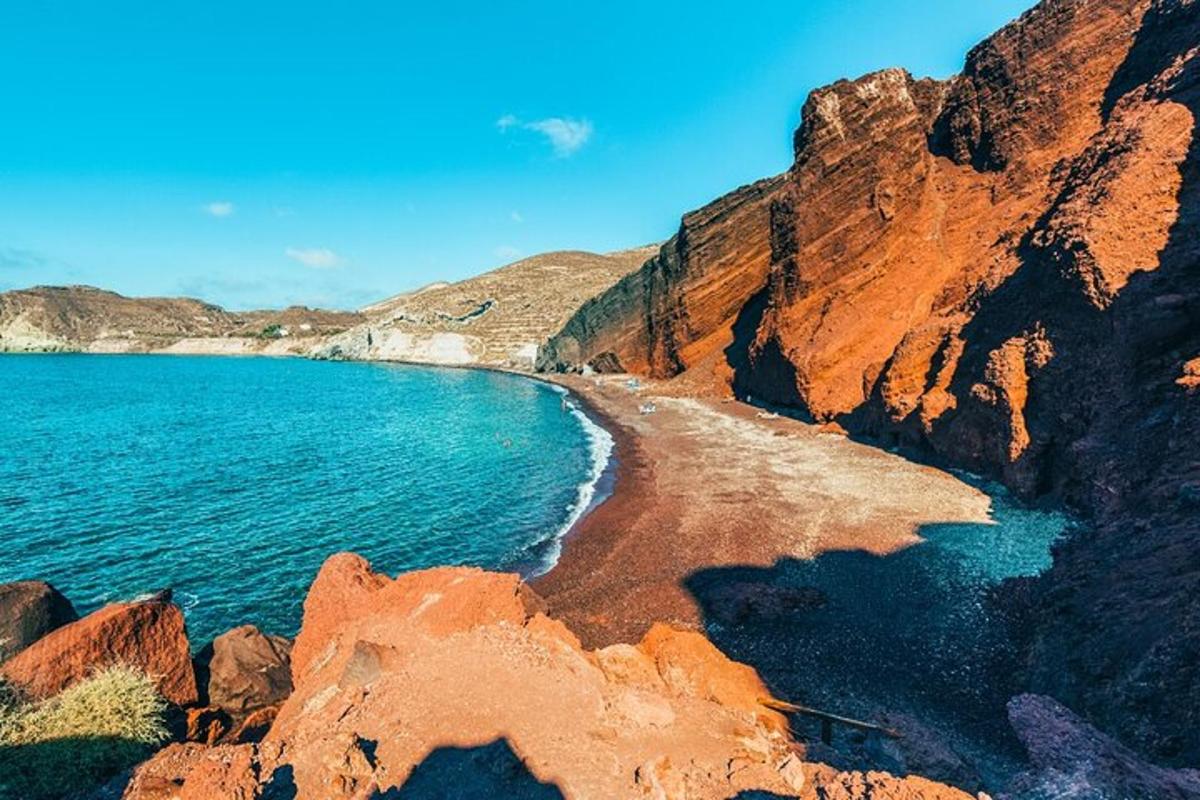 a view of a beach with rocks and water