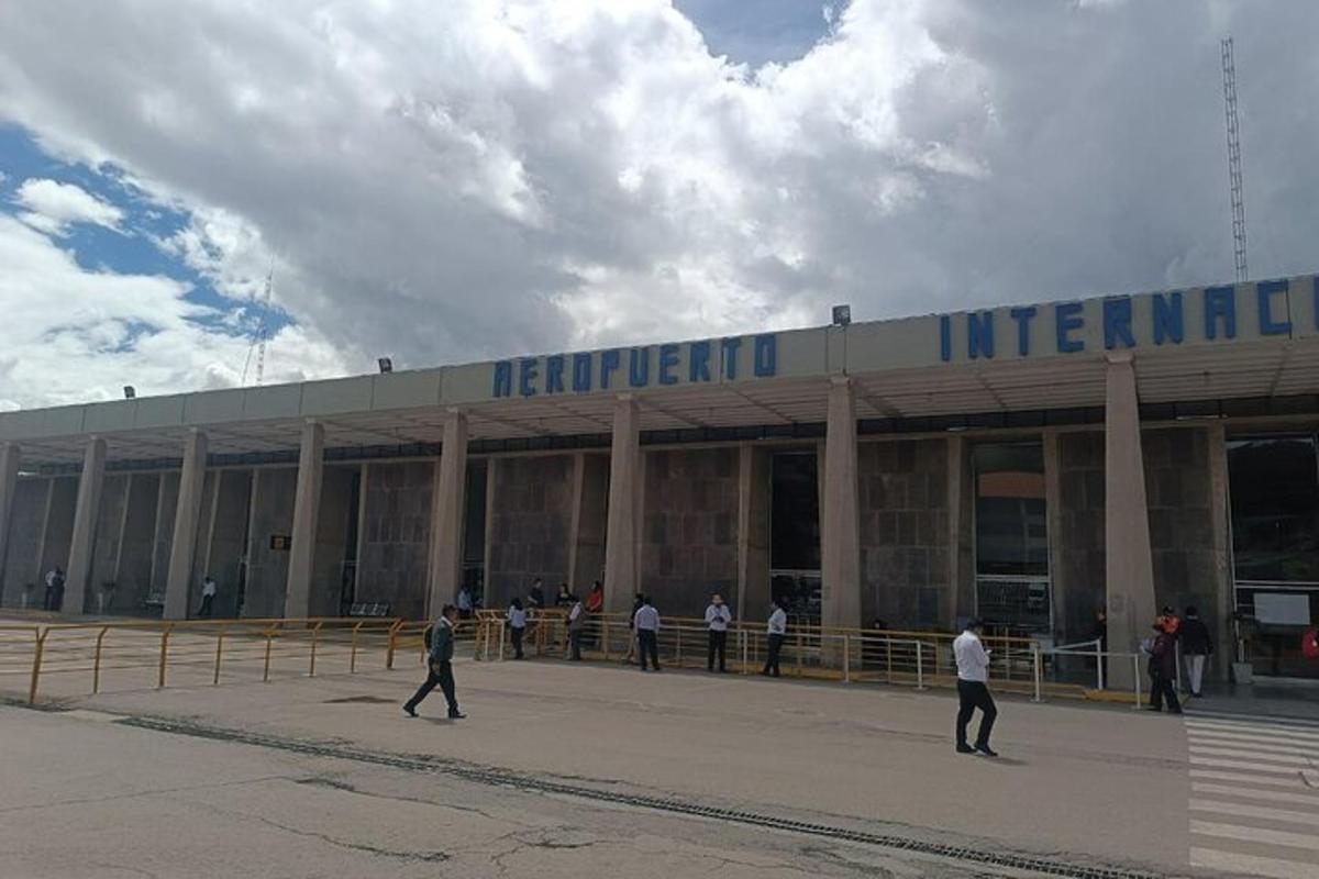 a large building with people standing outside of it