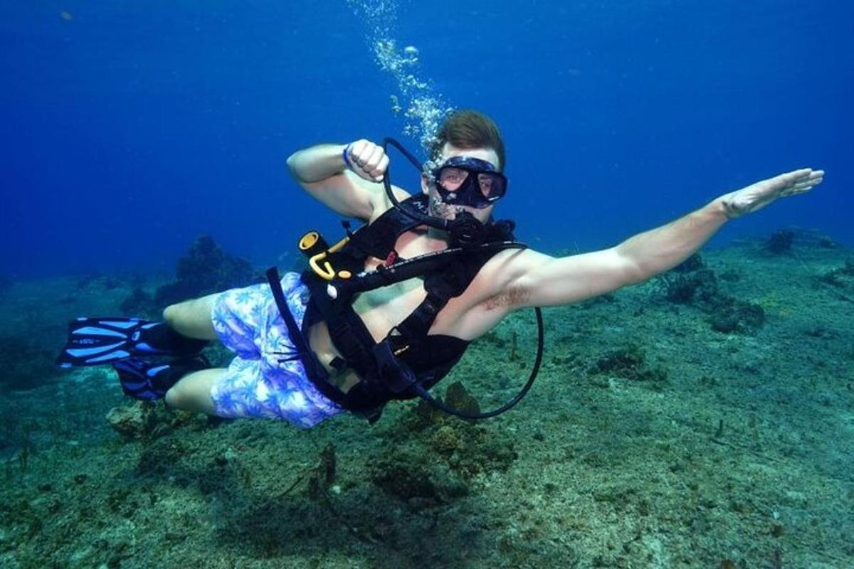 a person laying on the ground in the ocean