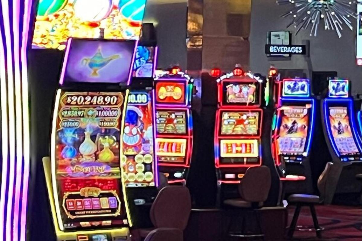 a row of slot machines in a casino