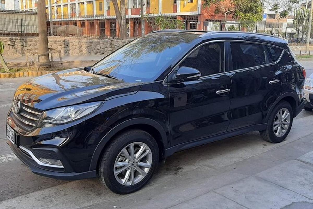 a black suv parked on the side of a street