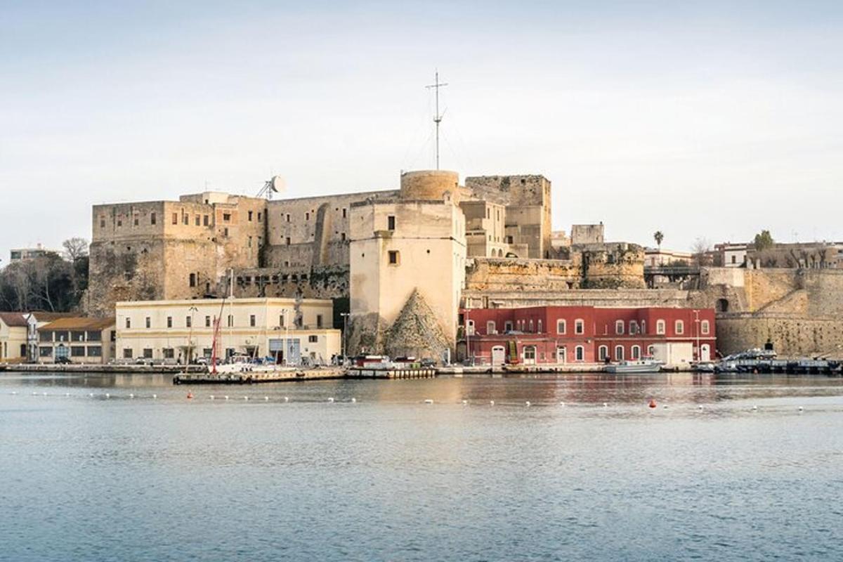 a large castle sitting next to a large body of water