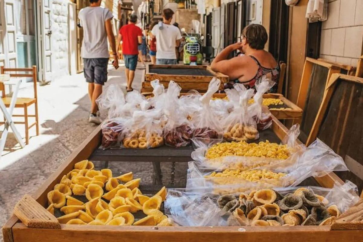 a woman standing in front of a market with food