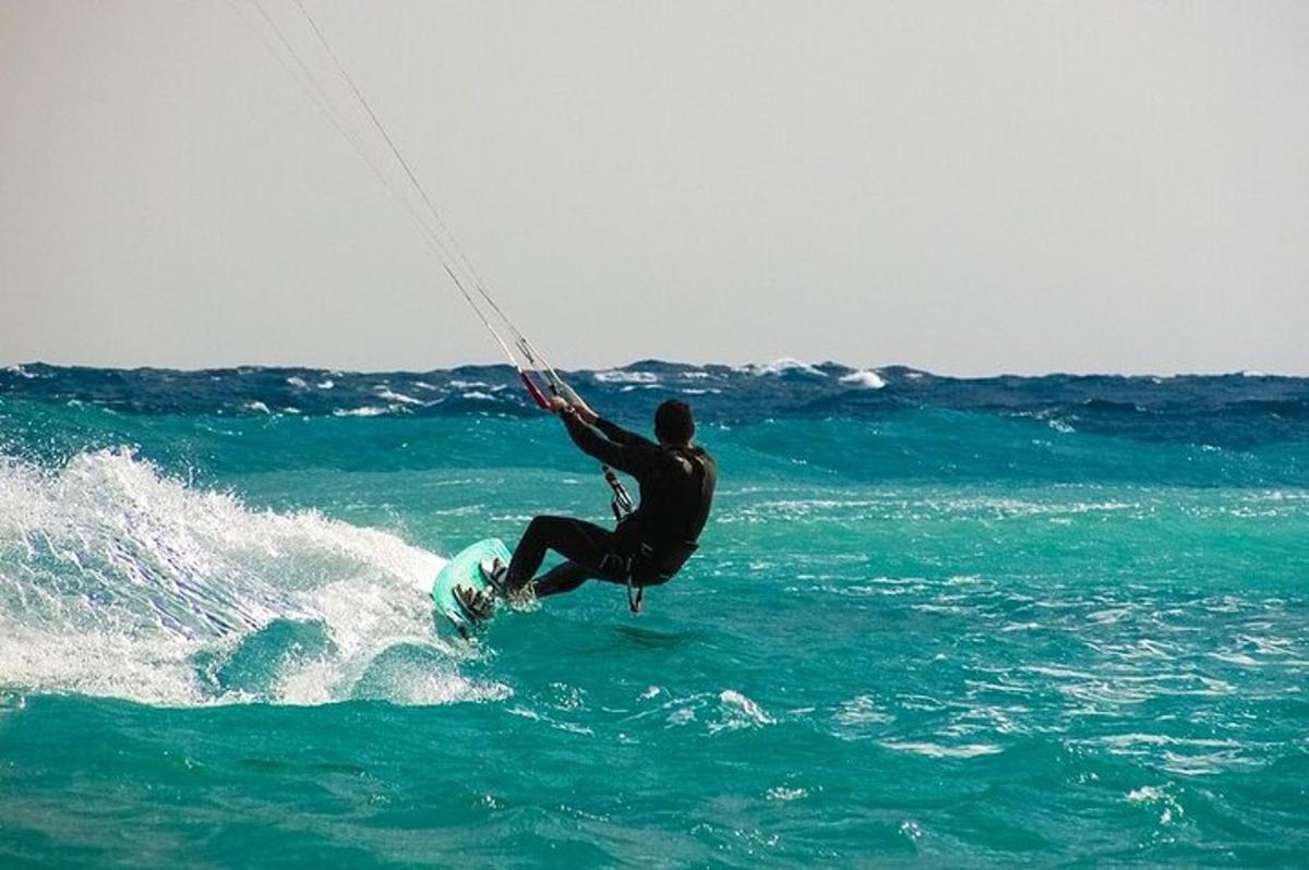 a man riding a wave on a surfboard in the ocean