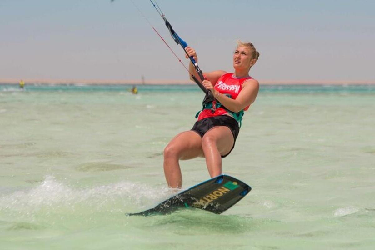 a woman is on a board in the water