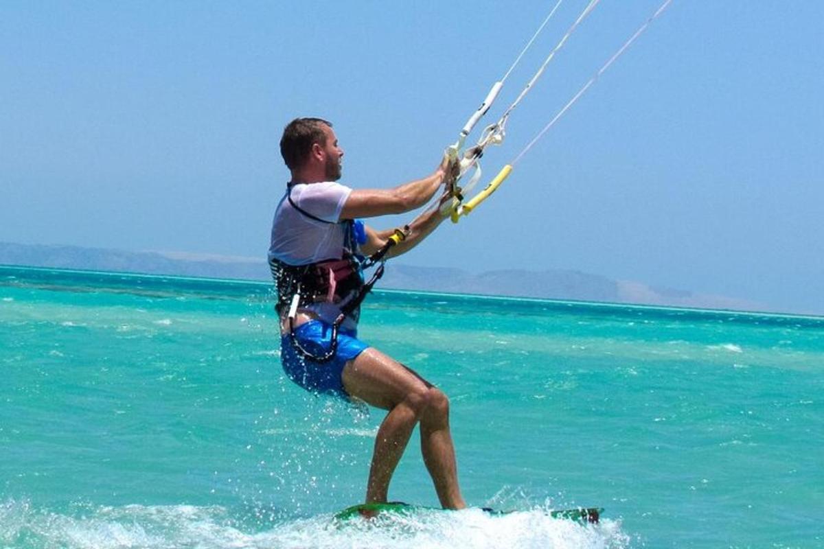 a man is on a surfboard in the water
