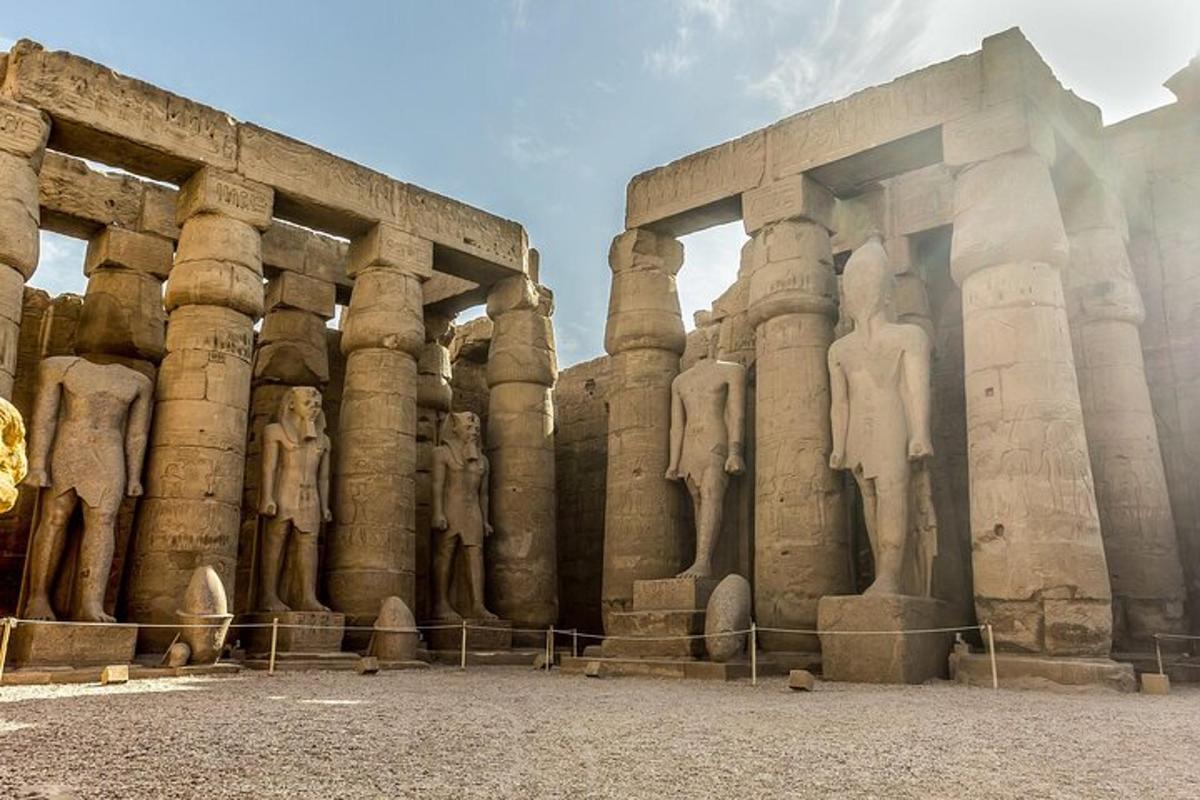 a large building with statues on the side of it
