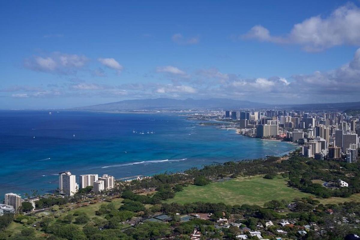 an aerial view of a city and the ocean