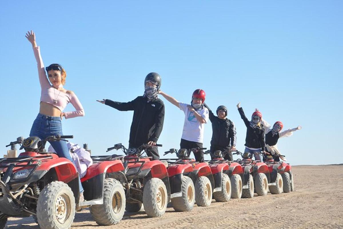 a group of people on atvs in the desert