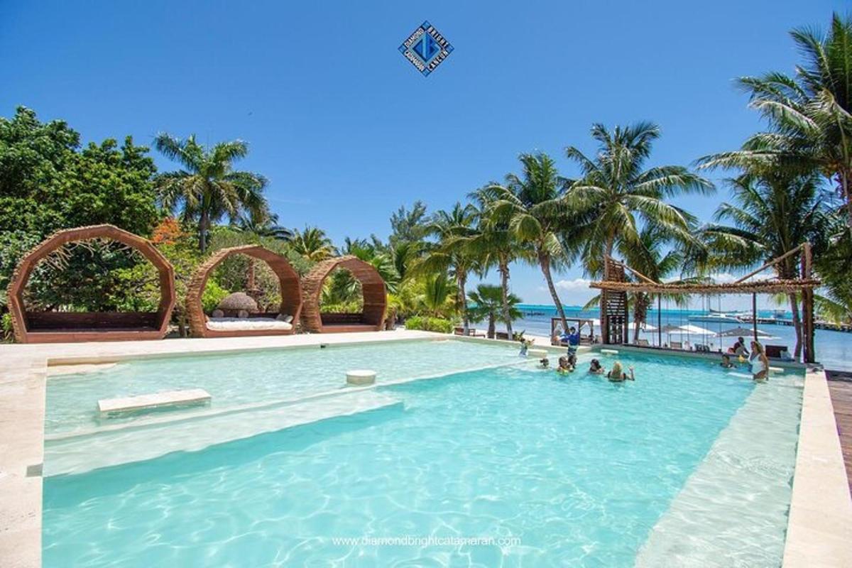 a swimming pool at a resort with people in it