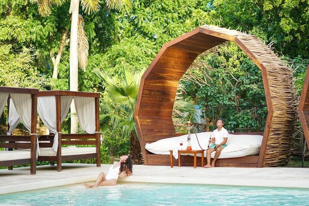 a man and a woman in a gazebo in a swimming pool