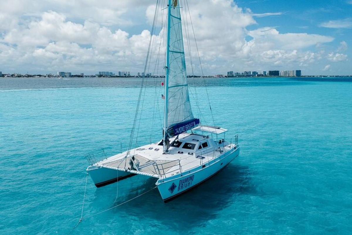 a sail boat in the water on the ocean