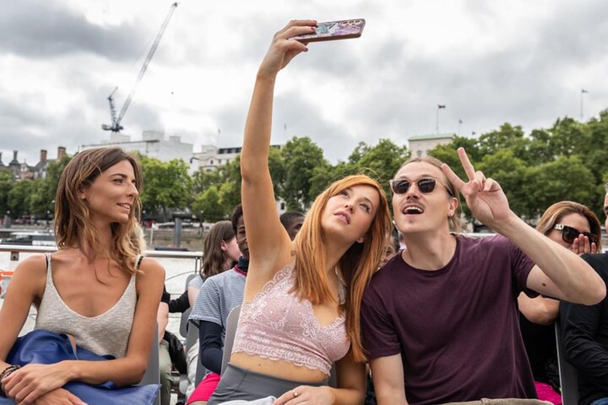 a group of women sitting in a crowd taking a picture