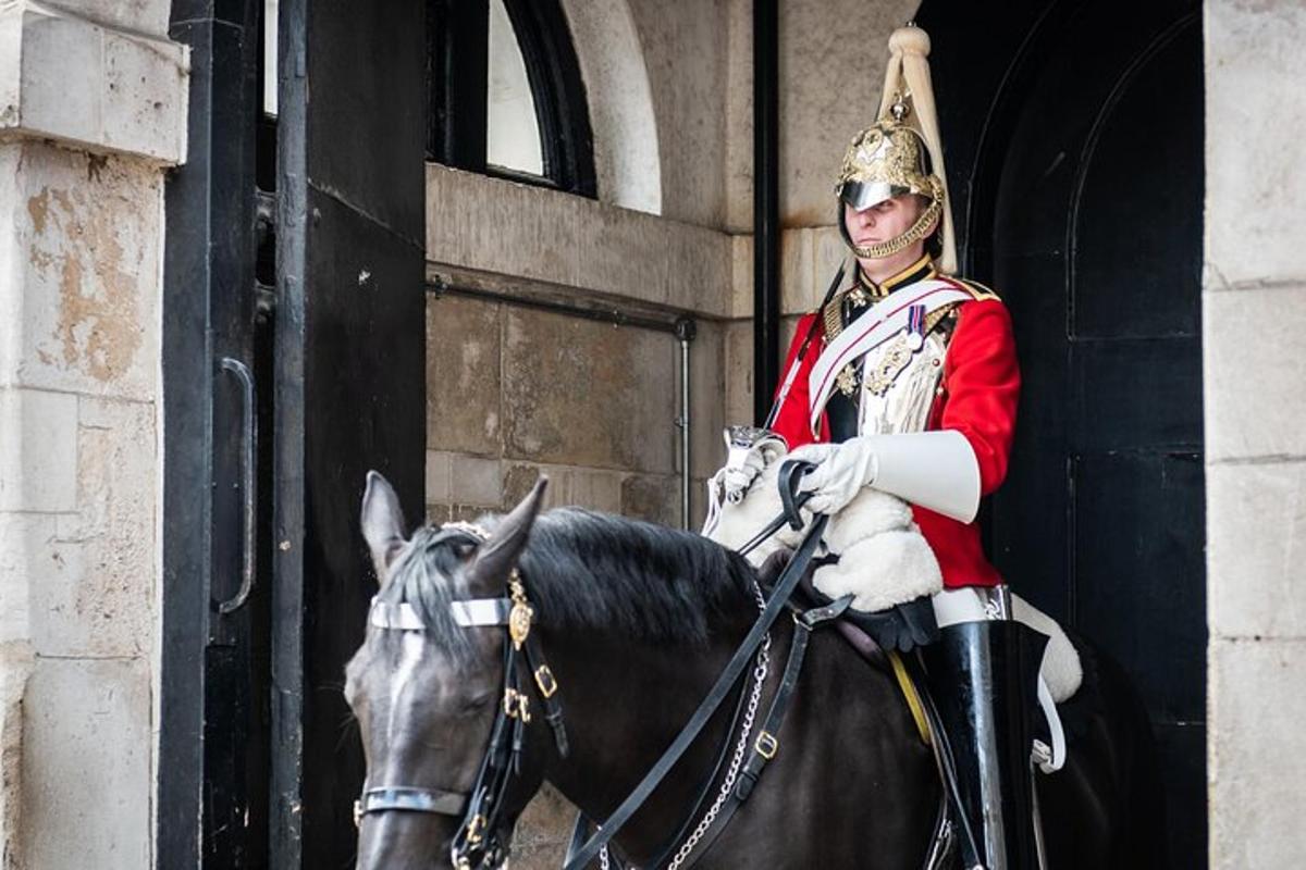 a man in uniform riding on a horse