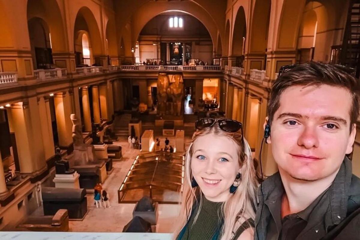 a man and a woman standing in a large building