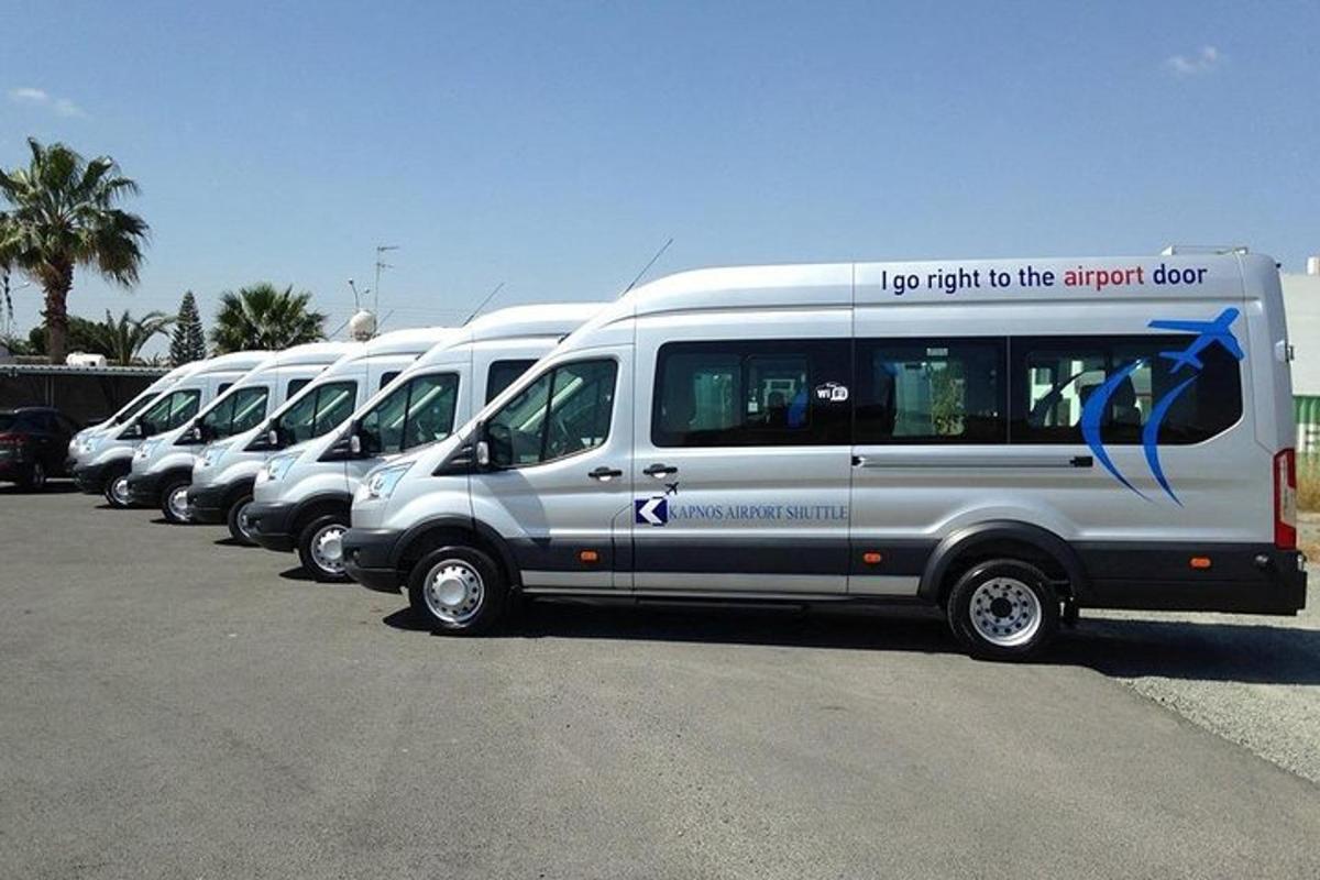 a row of vans parked in a parking lot