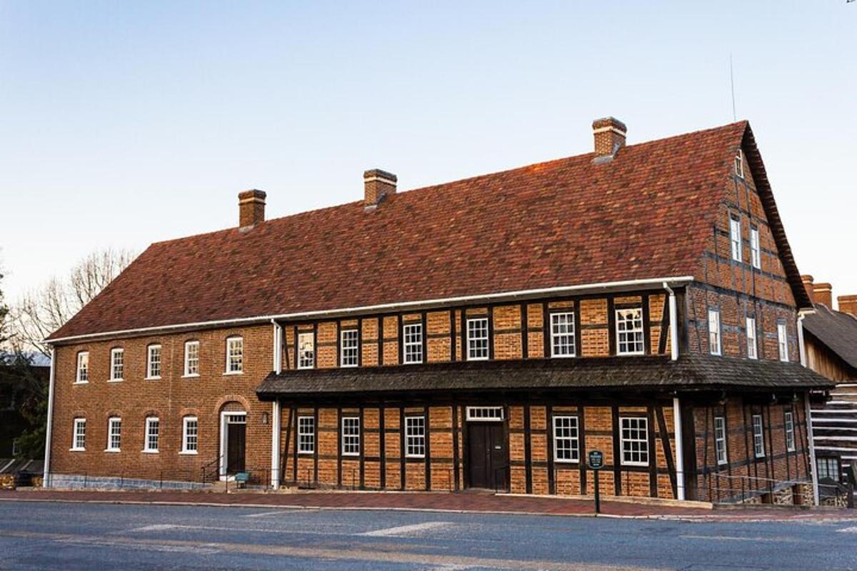 a large red brick building with a brown roof