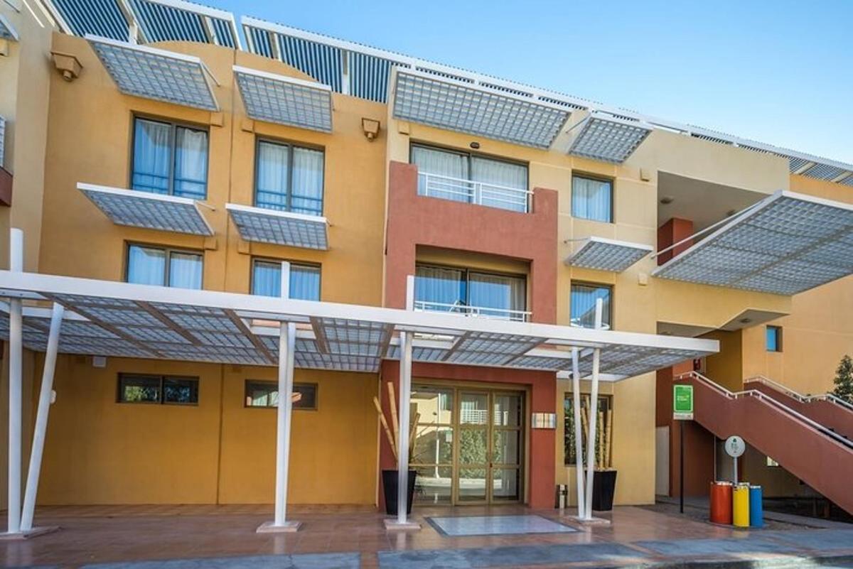 a building with solar panels on the side of it