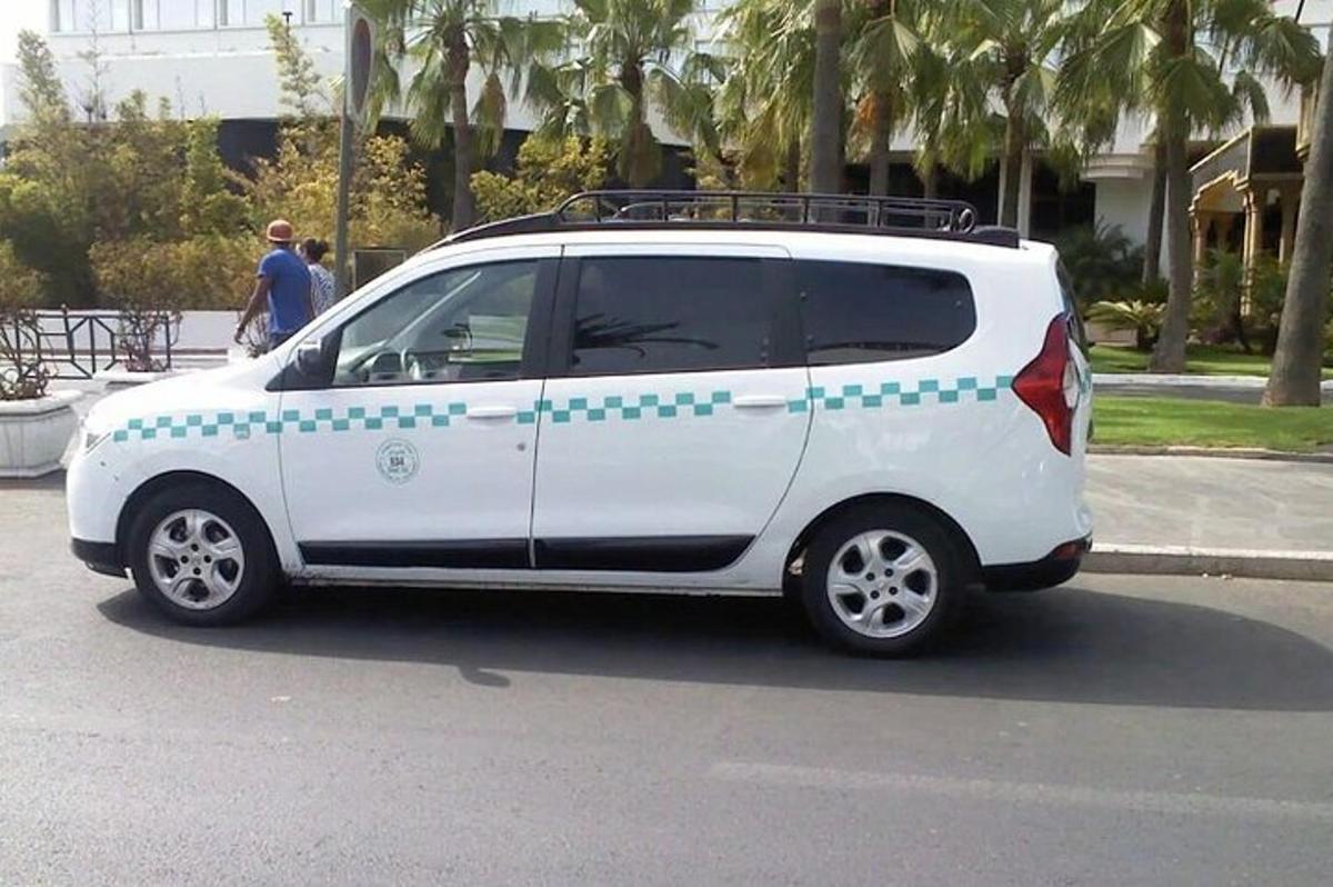 a white van with blue polka dots painted on it