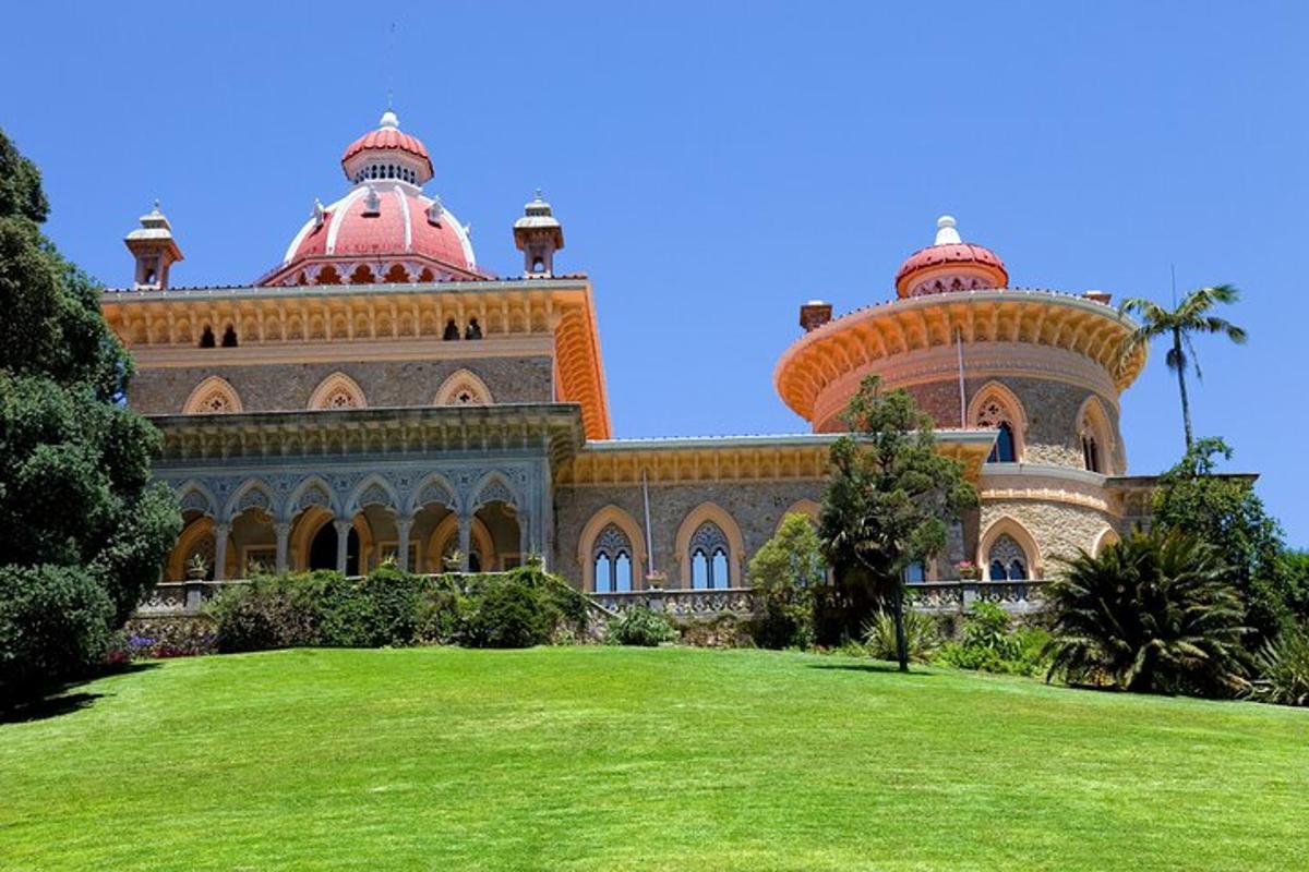 a large building with two domes on top of a field