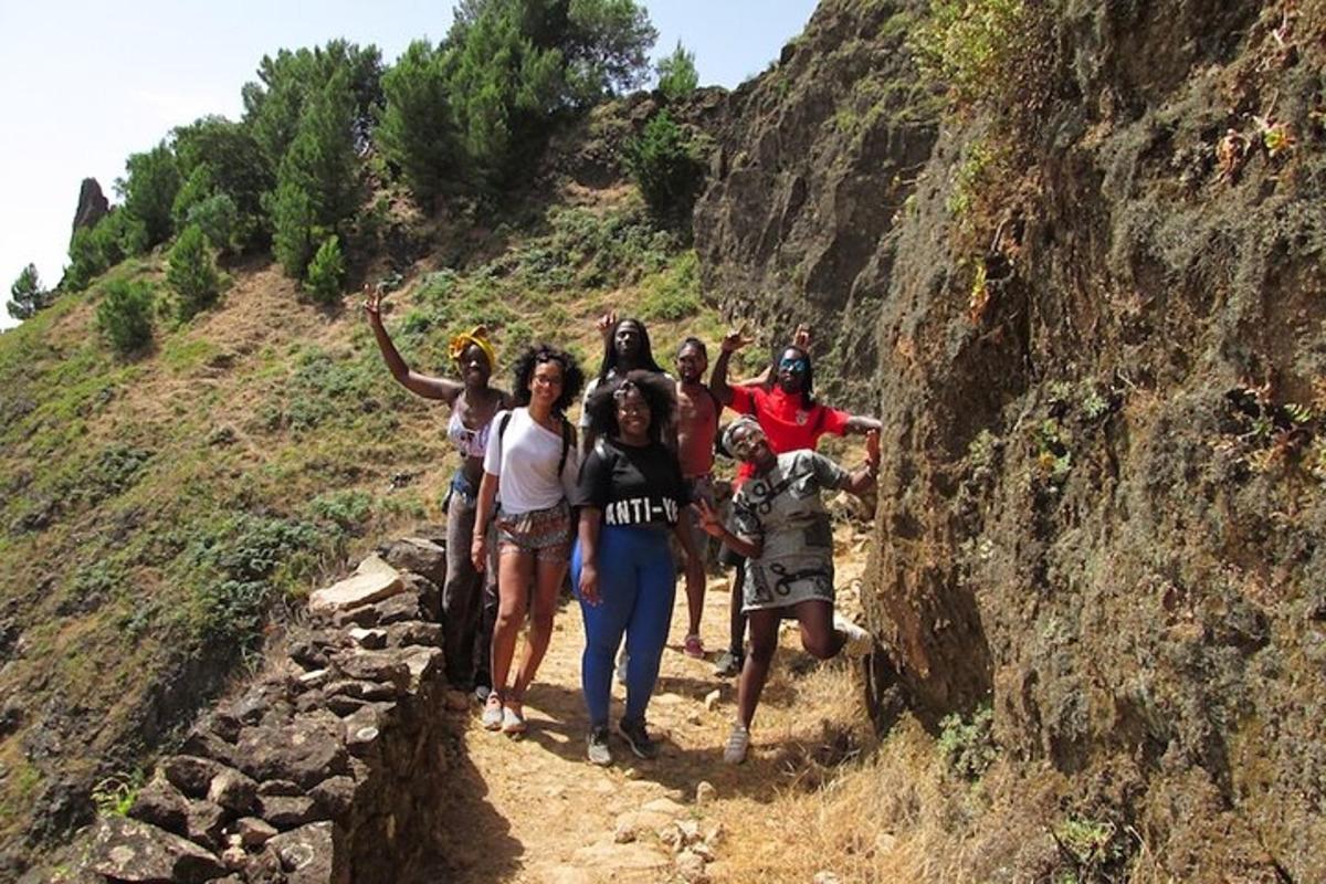a group of people standing on a mountain
