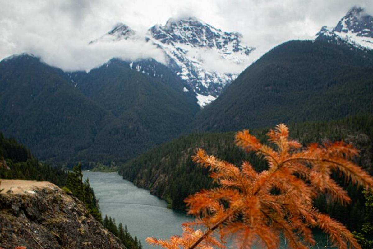 a view of a river in a valley with mountains