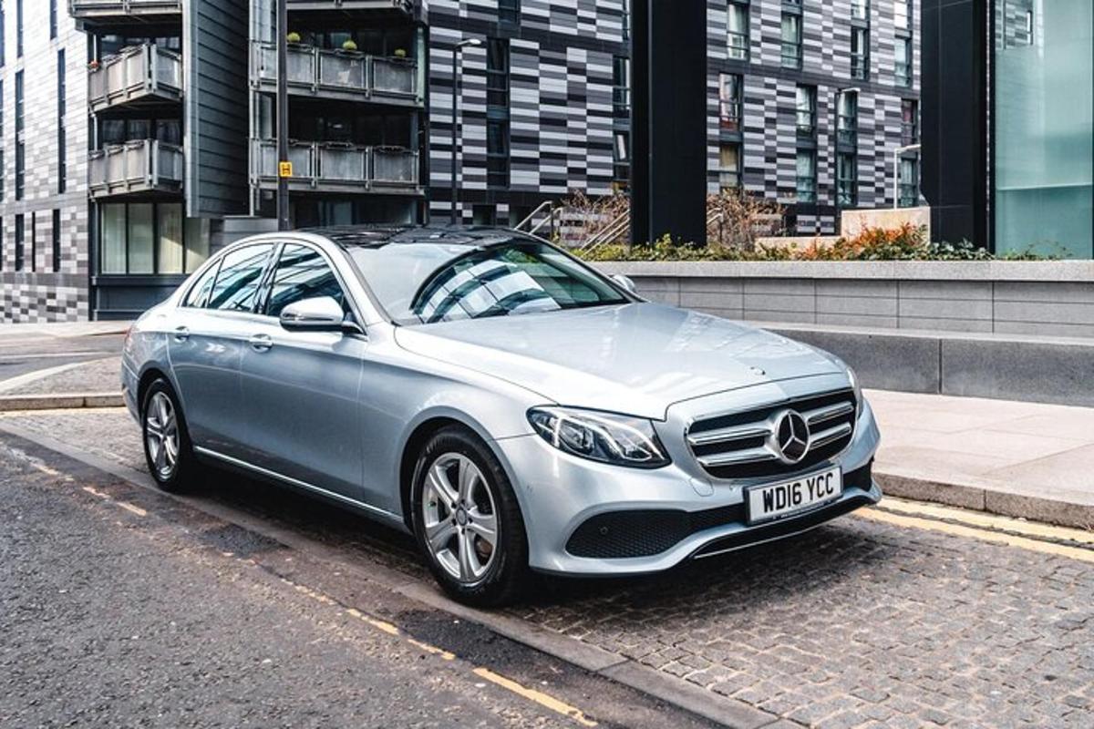 a silver car parked on the side of a street