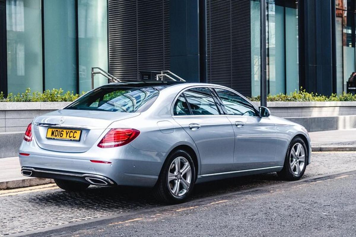 a silver car parked on the side of a street