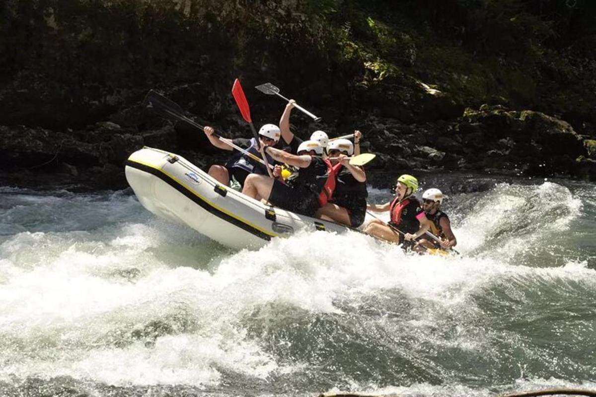 a group of people on a raft in the water