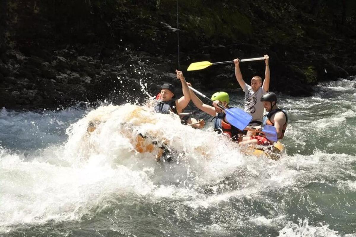 a group of people on a raft in a river
